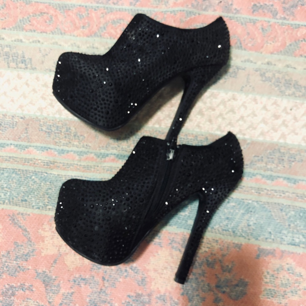 Black embellished platform booties.